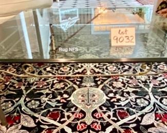 Lot 9032. $550.00. Glass & Iron Coffee Table with a very clean line - will fit any decor.  Measures 42" square, x 17" tall.  We like the fact that a glass coffee table opens up the room, where a wooden solid one might chop it up.  