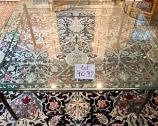 Lot 9032. $550.00. Glass & Iron Coffee Table with a very clean line - will fit any decor.  Measures 42" square, x 17" tall.  We like the fact that a glass coffee table opens up the room, where a wooden solid one might chop it up.  