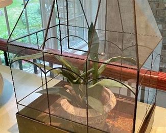 Lot 9041. $45.00. Cute Tabletop Vintage Greenhouse with leaded glass on little feet, 14.5" x 9.5" x 21" - Has faux plant in a stone pot in it currently, however you can certainly use this with live plants, and it has been used in the past for that as there are rusty spots for water,  Center panel on top does swing open to water, and entire top (heavy) does lift up to plant or prune or whatever!  This is so sweet.  I think a a live orchid in here would look smashing!