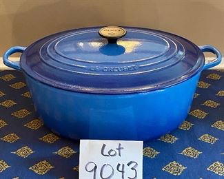 Lot 9043. $275.00. Le Creuset Oval 9.5 qt. Cast Iron Baker with Lid #35, in Blue. 14"w x 11" long x 5.5" tall. Sells on sale currently  at Williams Sonoma for $395; full retail is $500.00		
