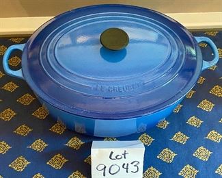 Lot 9043. $275.00.Le Creuset Oval 9.5 qt. Cast Iron Baker with Lid #35, in Blue. 14"w x 11" long x 5.5" tall. Sellls on sale currently  at Williams Sonoma for $395; full retail is $500.00		$275.00