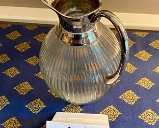 Lot 9051 $25.00  Ribbed Glass Pitcher with Silverplate handle and spout - no brand or signature 9.5" x 6.6" d.