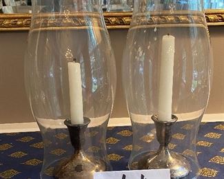 Lot 9061. $38.00. Pair of Hurricanes over Silverplate candlesticks by International Silver Co.  Hurricanes 14" t x 6" w and candlesticks are 4"t