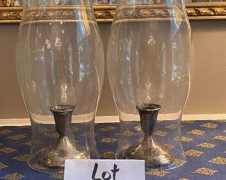 Lot 9061. $38.00. Pair of Hurricanes over Silverplate candlesticks by International Silver Co.  Hurricanes 14" t x 6" w and candlesticks are 4"t