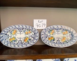 Lot 9079. $25.00. for the Pair of DeRuta-Style Oval plates - Blue design with fruit pattern, with hanger.  11" x7"w.  These plates look marvelous hung on a wall in a kitchen or dining room and we love the colors!