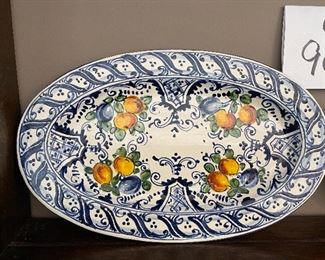 Lot 9079. $25.00. for the Pair of DeRuta-Style Oval plates - Blue design with fruit pattern, with hanger.  11" x7"w.  These plates look marvelous hung on a wall in a kitchen or dining room and we love the colors!