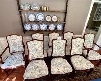 Lot 9086. $1600.00 FIRM. Lot of 8 Dining Chairs by Wellington Hall, which gave up their high-end furniture manufacturing operations in 2004.  Hekman may have purchased the brand name.   This lot includes  2 Captain (arm) Chairs, 6 Side Chairs.  Chairs are upholstered in Beige with a Heather Blue Floral Pattern.  A couple of the chairs' fabric may have been yellowed a bit by the sun, and one chair leg met their dog when she was apparently hungry!   Nice Chairs were very expensive new.  21" w x 18.5"Deep x 18" Seat to floor, 42" tall on the back.  Could use a little TLC but was quality built, so as we like to say, the chairs have "good bones" and the dog would say the chair tastes pretty fine as well.  