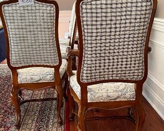 Lot 9086. $1600.00 FIRM. Lot of 8 Dining Chairs by Wellington Hall, which gave up their high-end furniture manufacturing operations in 2004.  Hekman may have purchased the brand name.   This lot includes  2 Captain (arm) Chairs, 6 Side Chairs.  Chairs are upholstered in Beige with a Heather Blue Floral Pattern.  A couple of the chairs' fabric may have been yellowed a bit by the sun, and one chair leg met their dog when she was apparently hungry!   Nice Chairs were very expensive new.  21" w x 18.5"Deep x 18" Seat to floor, 42" tall on the back.  Could use a little TLC but was quality built, so as we like to say, the chairs have "good bones" and the dog would say the chair tastes pretty fine as well.  