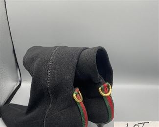 Lot 9145  $245.00  Beautiful pair of Vintage Gucci Ladies Black Boots with 2.5" heels, size 9B with an 18.5" rise from bottom of the heel to the top.  Side Zipper, canvas with some stretch to it for comfort.  Green and Red stripe in back above heel - very good used condition, worn, but pampered.    Style #116089.  These boots will never go out of style!