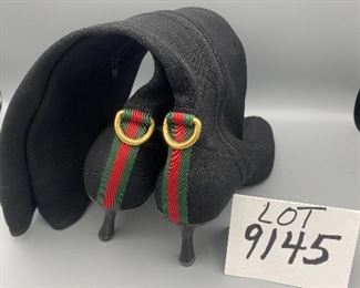 Lot 9145  $245.00  Beautiful pair of Vintage Gucci Ladies Black Boots with 2.5" heels, size 9B with an 18.5" rise from bottom of the heel to the top.  Side Zipper, canvas with some stretch to it for comfort.  Green and Red stripe in back above heel - very good used condition, worn, but pampered.    Style #116089.  These boots will never go out of style!
