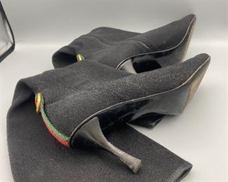 Lot 9145  $245.00  Beautiful pair of Vintage Gucci Ladies Black Boots with 2.5" heels, size 9B with an 18.5" rise from bottom of the heel to the top.  Side Zipper, canvas with some stretch to it for comfort.  Green and Red stripe in back above heel - very good used condition, worn, but pampered.    Style #116089.  These boots will never go out of style!