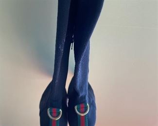 Lot 9145  $245.00  Beautiful pair of Vintage Gucci Ladies Black Boots with 2.5" heels, size 9B with an 18.5" rise from bottom of the heel to the top.  Side Zipper, canvas with some stretch to it for comfort.  Green and Red stripe in back above heel - very good used condition, worn, but pampered.    Style #116089.  These boots will never go out of style!