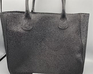 Lot 9149. $60.00. Mark & Graham Pebble Leather in Black Bucket Tote Bag or "Slouch Handbag". Features one inside zipper compartment, 2 more open pockets for stashing phone.  Made in Italy, has small monogrammed "N" on front, not problematic.  Made in Italy.  Expensive new.