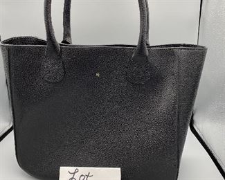 Lot 9149. $60.00. Mark & Graham Pebble Leather in Black Bucket Tote Bag or "Slouch Handbag". Features one inside zipper compartment, 2 more open pockets for stashing phone.  Made in Italy, has small monogrammed "N" on front, not problematic.  Made in Italy.  Expensive new.