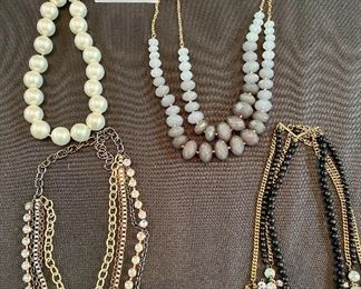 Lot 9142. $60.00. Lot of 4 Costume Jewelry Necklaces, multi -strand except for the large Betty Rubble pearl necklace; all of them make a statement.  See pics for closeups and a better description.  All are unbranded and vintage.