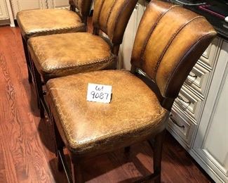 Lot 9087.   $360.00 for Three Williams-Sonoma bar stools with metal wrapped foot bar and nail head trim.  Faux leather with distressed look.  The stools retailed for over $1,000 each, yours for a fraction of that if you are the buyer!
