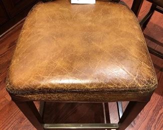 Lot 9087.   $360.00 for Three Williams-Sonoma bar stools with metal wrapped foot bar and nail head trim.  Faux leather with distressed look.  The stools retailed for over $1,000 each, yours for a fraction of that if you are the buyer!