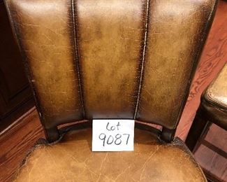 Lot 9087.   $360.00 for Three Williams-Sonoma bar stools with metal wrapped foot bar and nail head trim.  Faux leather with distressed look.  The stools retailed for over $1,000 each, yours for a fraction of that if you are the buyer!