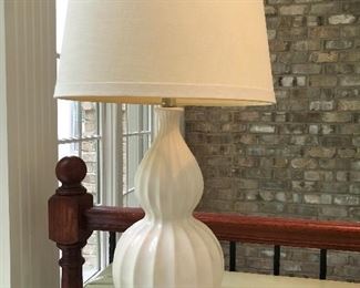 Lot 9039. $40.00. White Porcelain double decker ribbed base lamp with creamy white shade.  Measures 24.75" tall, x 12" diameter wide at top. of shade.  Excellent Condition. 
