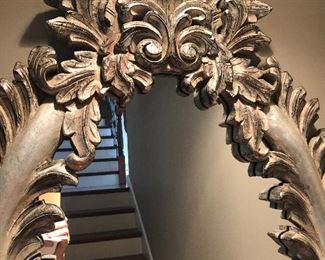 Lot 9103 #285.00. Beautiful, oval mirror with stunning  wood frame, highly detailed and finished in platinum/silver tones.