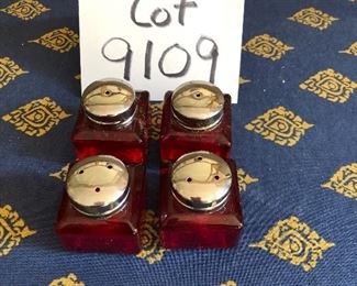 Lot 9109.  $40.00 Hammered brass footed, serving bowl with handles and 4 cranberry glass S/P shakers.
