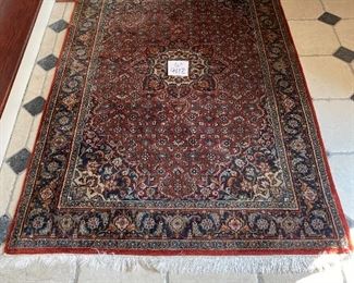 Lot 9112. $245.00. Pretty,  Unlabeled 4' x 6.5'  fringed area rug, in rust, cream & navy - wool.	Nice size for an entry way, foyer or under a cocktail table.