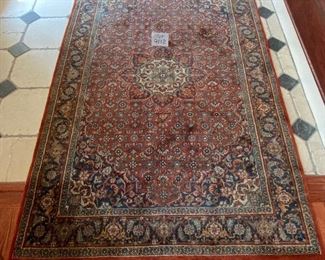 Lot 9112. $245.00. Pretty,  Unlabeled 4' x 6.5'  fringed area rug, in rust, cream & navy - wool.	Nice size for an entry way, foyer or under a cocktail table.