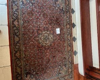 Lot 9112. $245.00. Pretty,  Unlabeled 4' x 6.5'  fringed area rug, in rust, cream & navy - wool.	Nice size for an entry way, foyer or under a cocktail table.