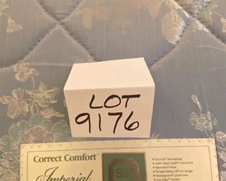 Lot 9176.  $1,200.00. Anthropologie Queen wood and cream upholstered bed, with a Stearns & Foster mattress. 	head board: 67" W x 66" H