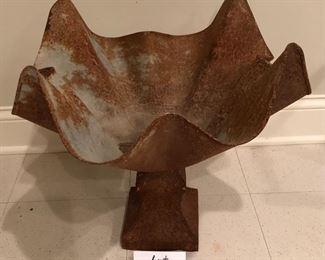Lot 9119.  $48.00 Interesting ruffled edged, metal pedestal planter. Planter has aged outdoors which adds to its appeal.	20" sq x 19" T