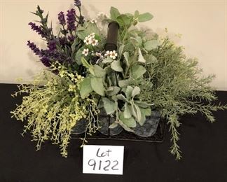 Lot 9122.  $40.00 Wire basket with and and 6 metal canisters of faux greener.  Adorable.	12" W x 8" Deep x 14" to top of greenery