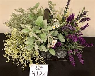 Lot 9122.  $40.00 Wire basket with and and 6 metal canisters of faux greener.  Adorable.	12" W x 8" Deep x 14" to top of greenery