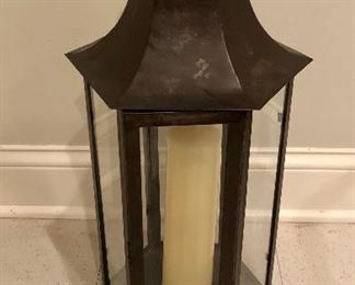 Lot 9124.  $60.00. Glass and metal, weathered lantern with candle.  Great fireplace accent piece.	25" T x 10" diam