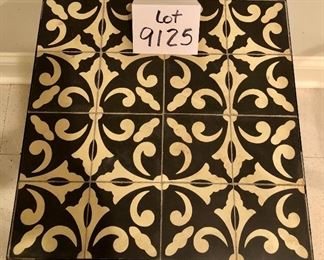 Lot 9125.  $40.00 Tile topped, metal frame table.  Very solid and nice tile for current styling.	16" W x 18.5" T