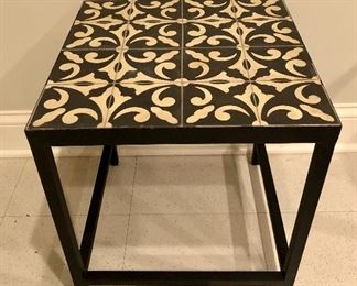 Lot 9125.  $40.00 Tile topped, metal frame table.  Very solid and nice tile for current styling.	16" W x 18.5" T