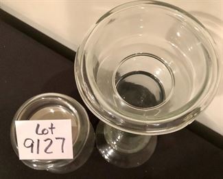 Lot 9127.  $40.00  Two clear glass candle holders, great for pillar candles and they each have a  taper holder in the base as well.  Versatile, clean style.	16" T and 6 " T , both with 6.5" base