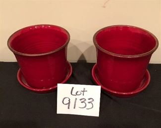 Lot 9133.  $50.00 2 red pots with attached saucers (6.5" diam x 5.5" T), made Portugal, and a wire hanging wall plant basket (23" W x 9.5" D x 15" T)