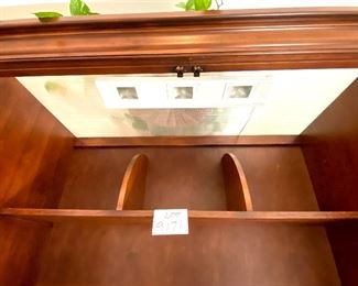 Lot 9171. $475.00.  Sligh Homeworks office/computer/ armoire/workstation, with a wood stained finish.  The large internal workspace includes keyboard drawer and storage. When you are finished with your project, the desk can be hidden away behind two large doors.	48.25" W x 71.5 T x 23.75" D