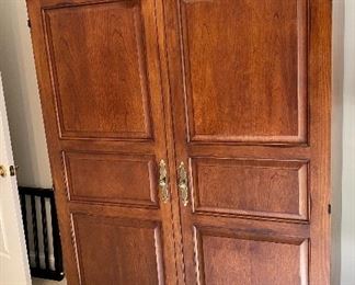 Lot 9171. $475.00.  Sligh Homeworks office/computer/ armoire/workstation, with a wood stained finish.  The large internal workspace includes keyboard drawer and storage. When you are finished with your project, the desk can be hidden away behind two large doors.	48.25" W x 71.5 T x 23.75" D