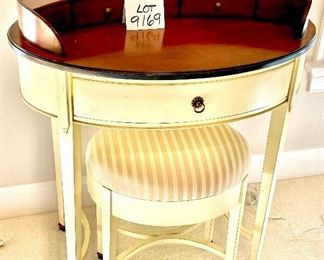 Lot 9169. $225.00 Williams Sonoma Home cream and wood finish 3 drawer oval shaped desk.  The desk comes with an oval bench upholstered in striped fabric.  Unusual and so feminine.  