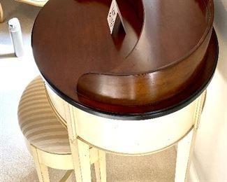 Lot 9169. $225.00 Williams Sonoma Home cream and wood finish 3 drawer oval shaped desk.  The desk comes with an oval bench upholstered in striped fabric.  Unusual and so feminine.  