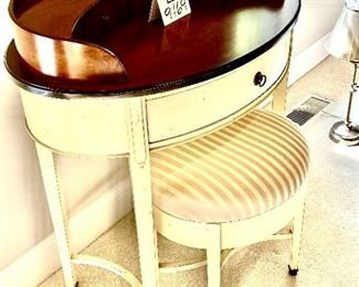 Lot 9169. $225.00 Williams Sonoma Home cream and wood finish 3 drawer oval shaped desk.  The desk comes with an oval bench upholstered in striped fabric.  Unusual and so feminine.  