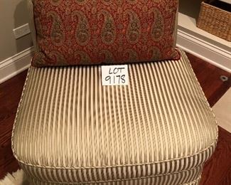 Lot 9178.  $225.00 each.  Two upholstered armless, slipper chairs in striped gold color tones and two Pottery Barn red & green paisley pillows.