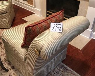 Lot 9178.  $225.00 each.  Two upholstered armless, slipper chairs in striped gold color tones and two Pottery Barn red & green paisley pillows.