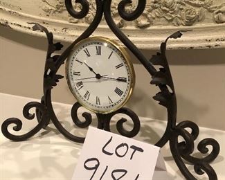 Lot 9181. $40.00.  Iron and metal, unbranded mantel/desk clock.  Very cute accent piece.