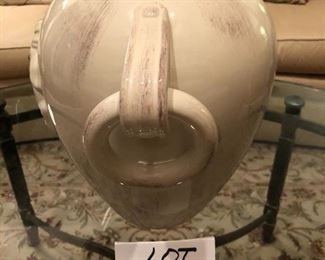 Lot 9182. $38.00 Cream colored, 2 handled ceramic vase, with a design in relief on the side.  