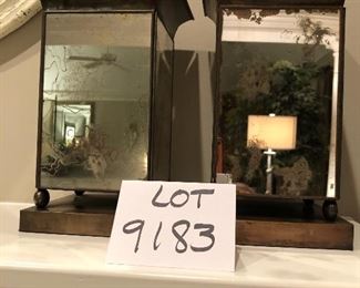     Lot 9183.  $45.00 A stylish pair of mirrored, metal vases.