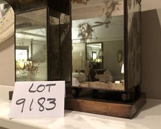   Lot 9183.  $45.00 A stylish pair of mirrored, metal vases.
