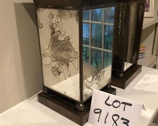 Lot 9183.  $45.00 A stylish pair of mirrored, metal vases.