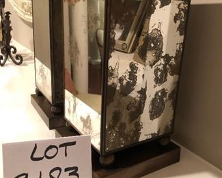   Lot 9183.  $45.00 A stylish pair of mirrored, metal vases.
